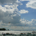 surfers and clouds